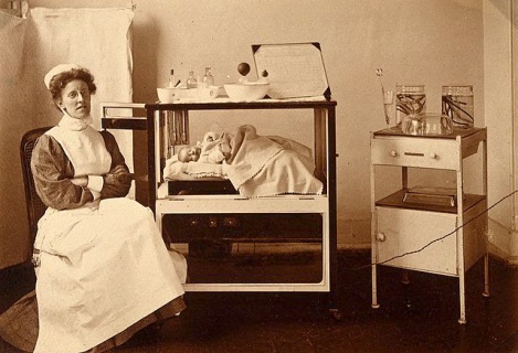 nurse with incubator