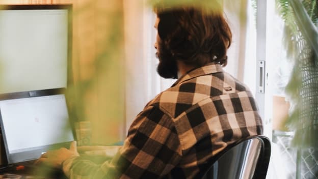 A man with a tablet at home